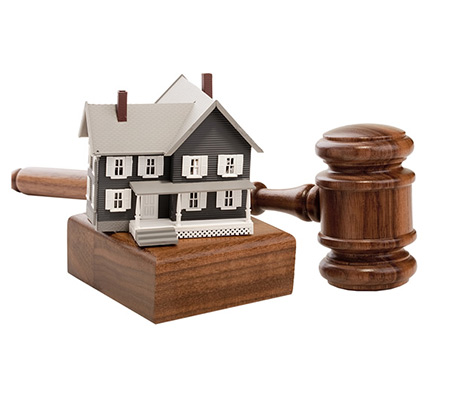 Gavel next to a tiny house